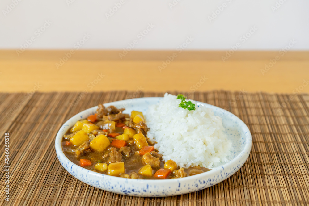 Japanese beef curry served with Japanese Rice close up. Traditional popular food of Japan. Japanese beef curry served with Japanese Rice close up. Traditional popular food of Japan.