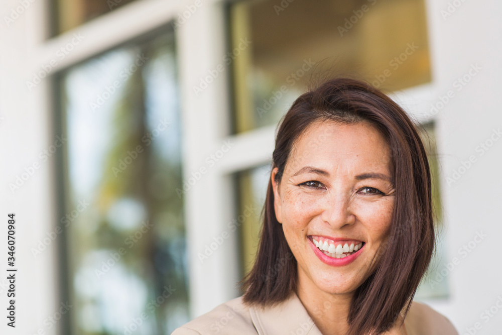Portrait of a confident Asian businesswoman smiling. Portrait of a confident Asian businesswoman smiling.