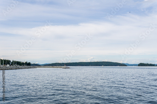 Haro strait view from Vancouver island with cloudy sky British Columbia Canada. © olegmayorov