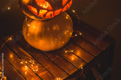 hand carved   Halloween spooky pumpkin and sparkly lights © qjpioneer