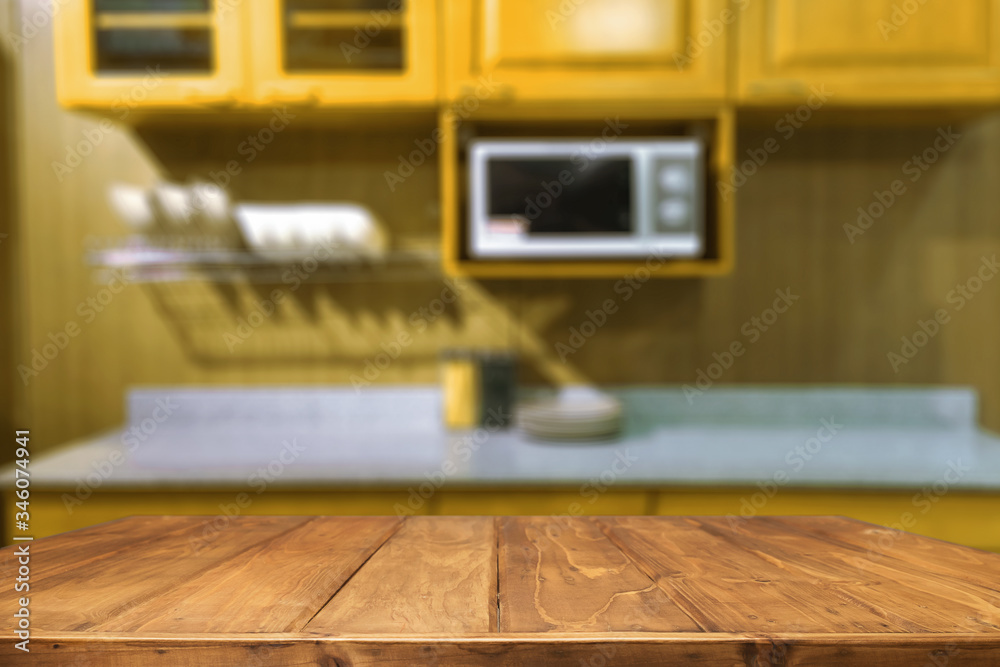 Wood desk space and blurred of kitchen background. for product display montage. business presentation. Wood desk space and blurred of kitchen background. for product display montage. business presentation.