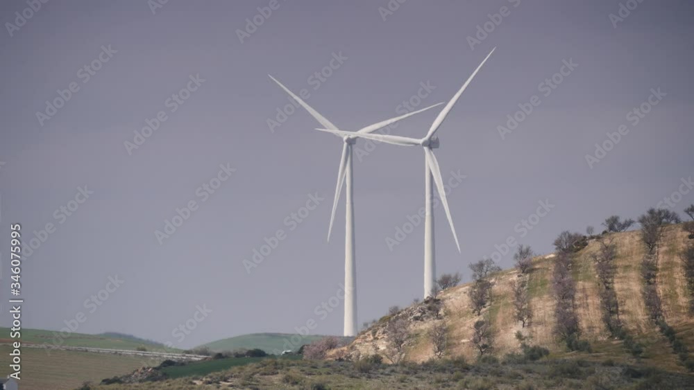Wind turbines on hills. Power generator farm for renewable electric energy production near Ardales, province Malaga, Andalusia Spain