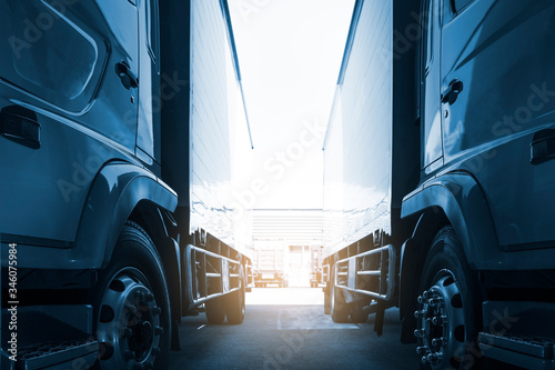 Cargo Trucks Parked lot at The Warehouse. Delivery Container Trucks. Cargo Shipping. Lorry. Industry Freight Truck Logistics Cargo Transport Concept. 