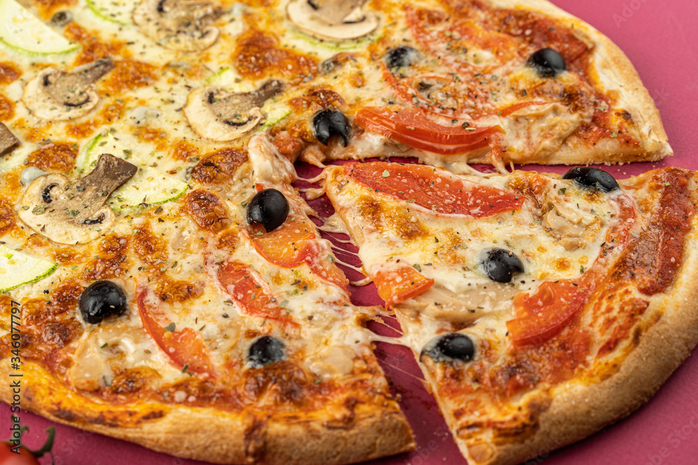 pizza close-up, isolated, against a colored background. whole pizza 