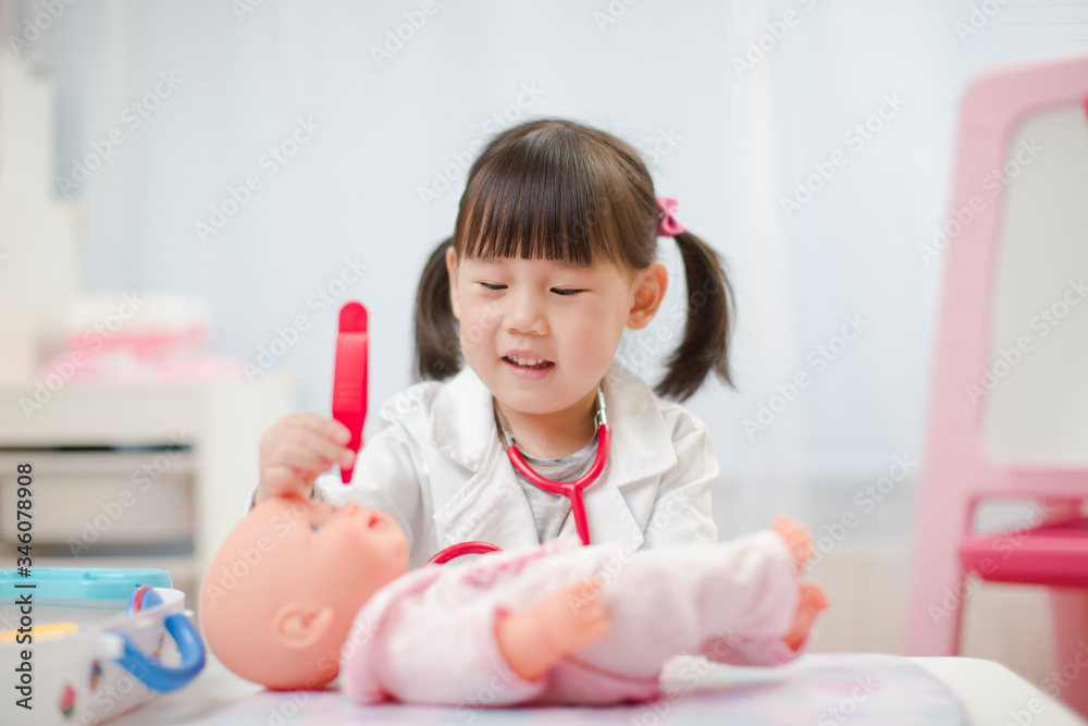 toddler girl pretend play doctor role at home against white background toddler girl pretend play doctor role at home against white background