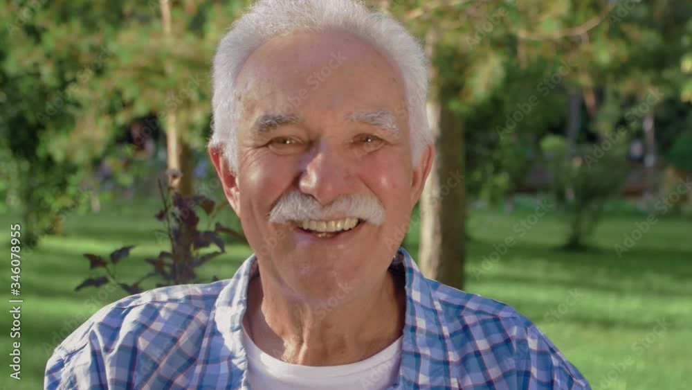 An old man portrait with emotions. Grandfather is smiling and looking to camera. An old man portrait with emotions. Grandfather is smiling and looking to camera.
