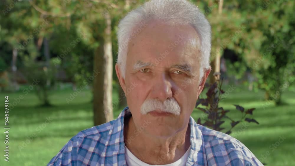 An old man portrait with emotions. Grandfather is sad and looking to camera. An old man portrait with emotions. Grandfather is sad and looking to camera.
