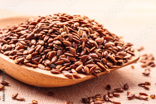 Flax seeds linseed on wooden spoon