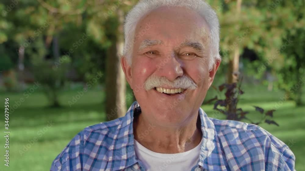An old man portrait with emotions. Grandfather is smiling and looking to camera. An old man portrait with emotions. Grandfather is smiling and looking to camera.