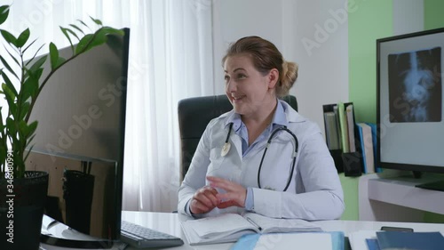 female doctor with phonendoscope speaking looking at webcam providing remote medical assistance in virtual chat, medic worker video calling consulting patient online