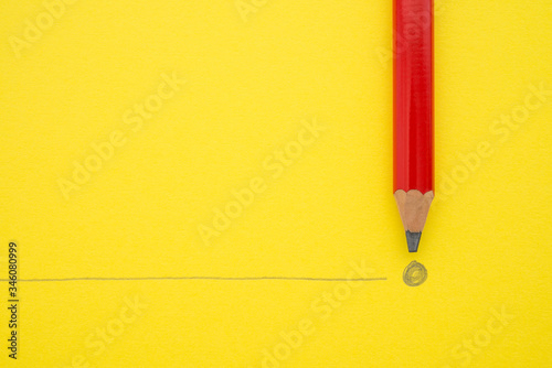 Black pencil write the end point on yellow paper background with copy space. Concept of conclusion, completion and successful in business target. photo