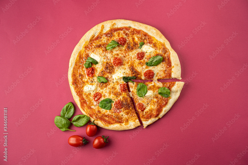 Fototapeta pizza close-up, isolated, against a colored background. whole pizza