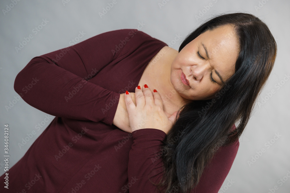 Adult woman having pain in chest Adult woman having pain in chest