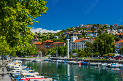 Croatia, city of Rijeka, skyline view from Delta and Rjecina river over the boats in front, colorful old buildings, monuments and Trsat on the hill in background
 photo