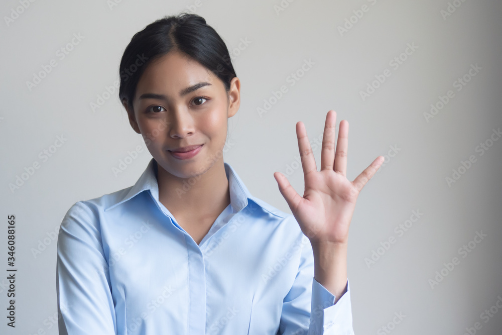 asian office woman pointing, counting five finger; portrait of positive happy smiling asian woman pointing up 5 fingers for number five or 5 points concept; southeast asian adult woman model asian office woman pointing, counting five finger; portrait of positive happy smiling asian woman pointing up 5 fingers for number five or 5 points concept; southeast asian adult woman model