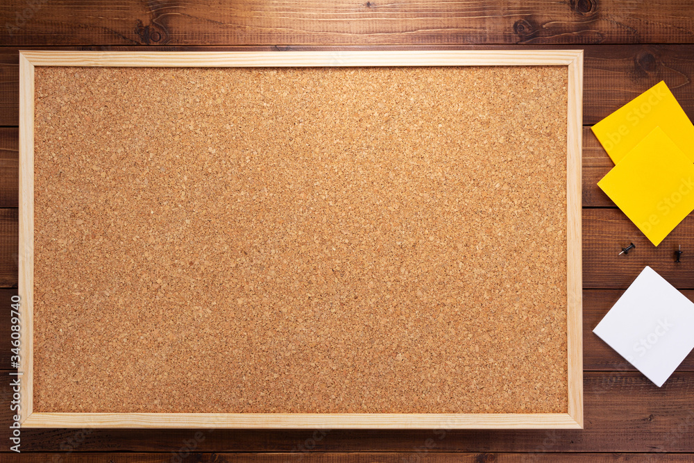 Fototapeta premium cork board on wooden background