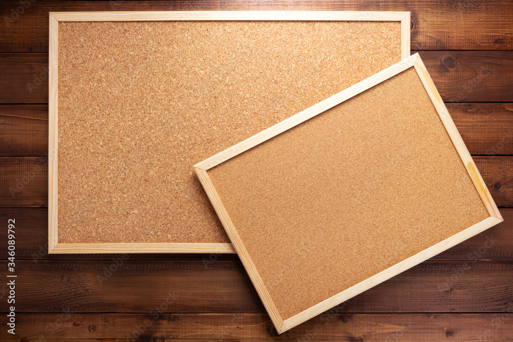 Fototapeta premium cork board on wooden background