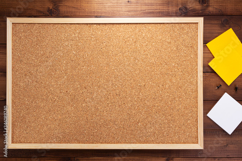 cork board on wooden background photo