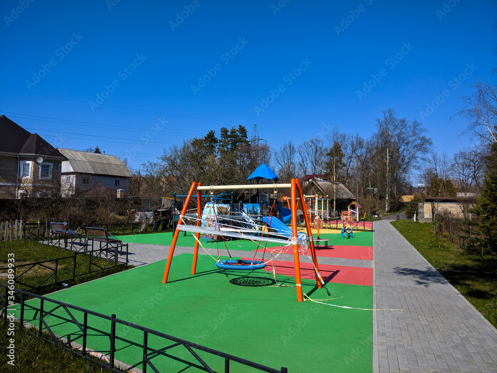 Playground closed during coronovirus pandemic. May sunny day in Russia.