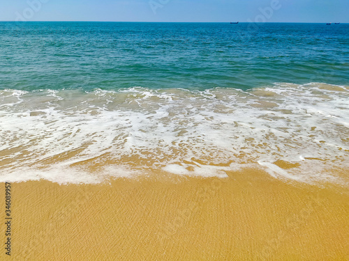 waves on the beach of Arabian sea under clear sky