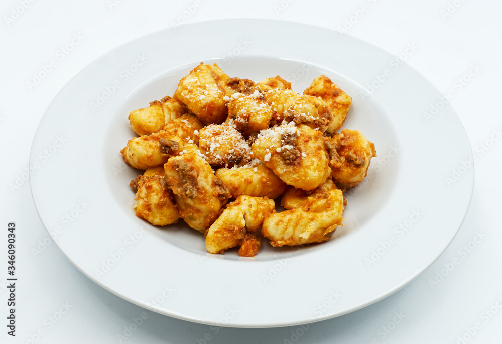 Gnocchi with ragu bolognese and parmesan cheese. Fresh pasta tradition of Italy. Gnocchi with ragu bolognese and parmesan cheese. Fresh pasta tradition of Italy.