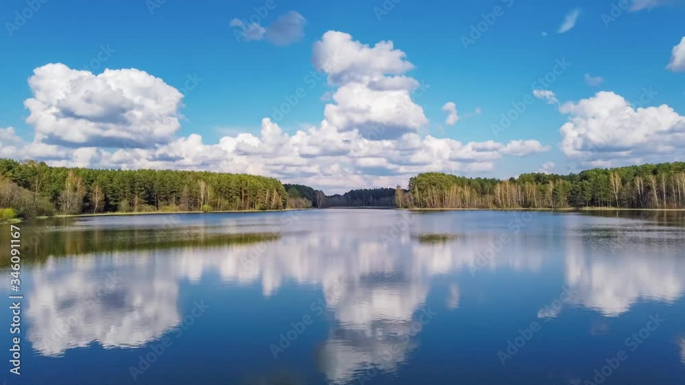 The clouds over the lake in Belarus. Timelapse footage 4K The clouds over the lake in Belarus. Timelapse footage 4K