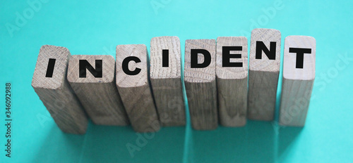 Bild auf Leinwand INCIDENT word made with wooden building block. Insurance concept