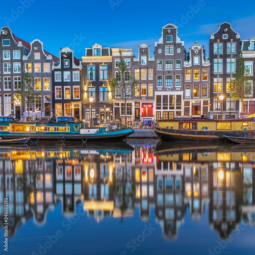 Night view of Amsterdam city. Famous Dutch channels and great cityscape.