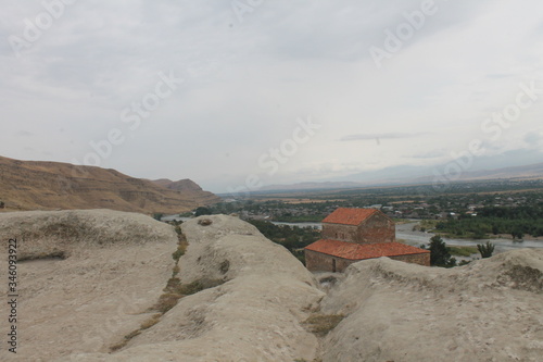 beige brown sand colored stones rocks in the city of Queen Tamara in the city of Vardzia photo