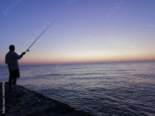 fishing at sunset