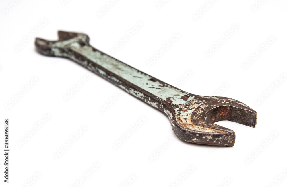 old spanner on a white background old spanner on a white background