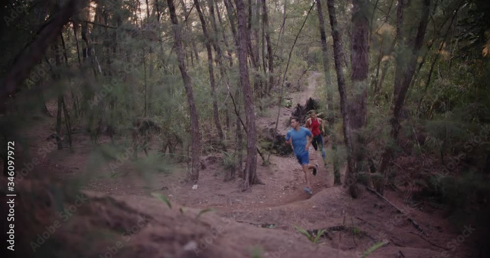 Couple running together in forest Couple running together in forest