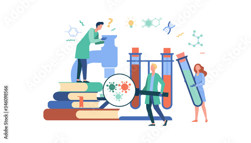 Group of scientists with microscope, chemical tubes and books doing epidemiology research. Chemists studying corona virus tests in medical lab. Can be used for coronavirus pandemic, covid 2019 topics