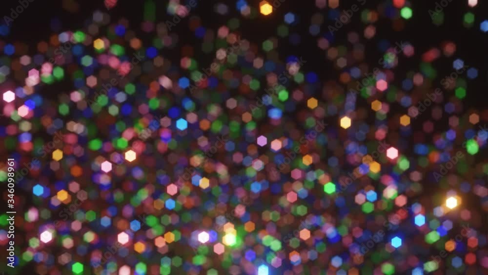 Defocus glitter background with colorful falling confetti. Confetti explosions on a black background. 4K animation Defocus glitter background with colorful falling confetti. Confetti explosions on a black background. 4K animation