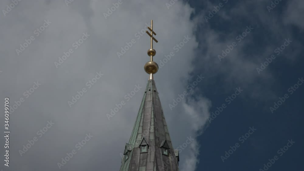 catholic church tower in front of clouds
catholic church tower in front of clouds