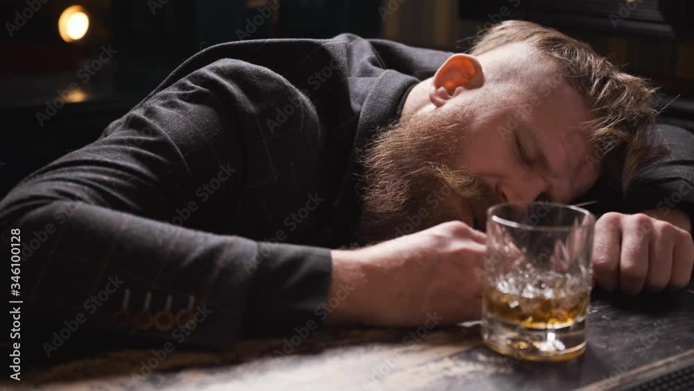 drunk man fell asleep at bar with glass of whiskey, Bourbon, Rum, feeling headache, Caucasian with beard and mustache, looks bad and upset, mumbles, close up, 4k drunk man fell asleep at bar with glass of whiskey, Bourbon, Rum, feeling headache, Caucasian with beard and mustache, looks bad and upset, mumbles, close up, 4k
