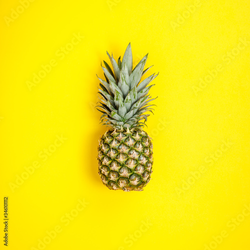 Pineapple on yellow background. Summer concept. Flat lay