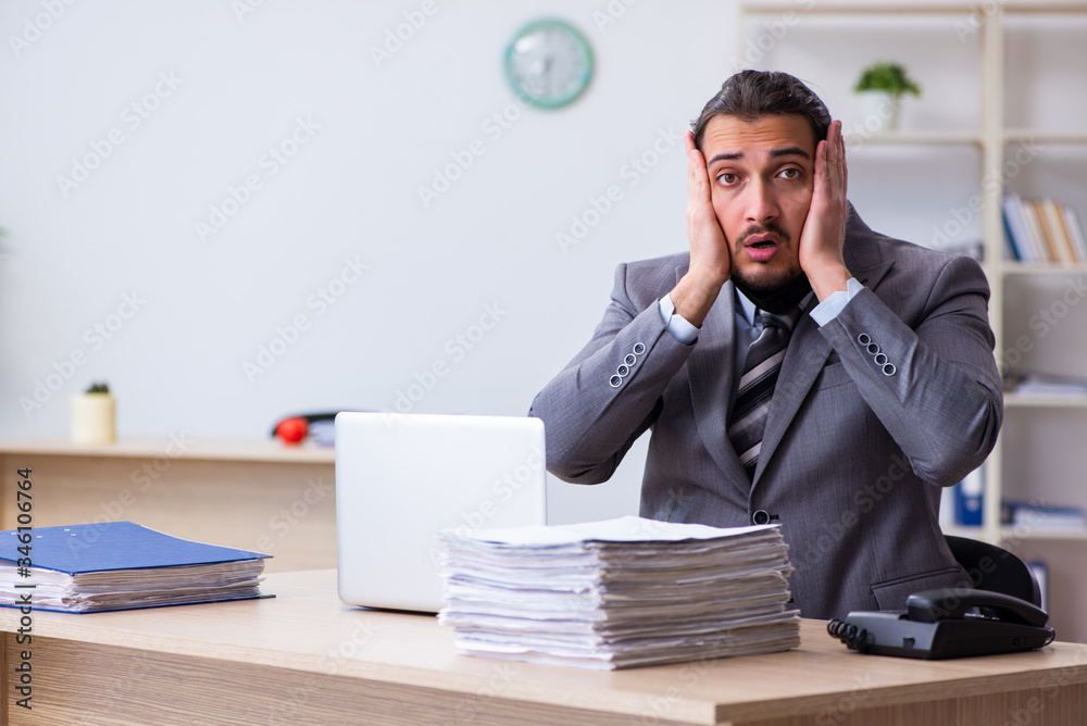 Young male employee in self-quarantine concept Young male employee in self-quarantine concept
