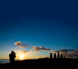Unrecognizable photographer takes photos of moai platform