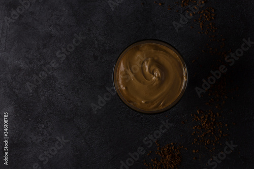 Cold dalgon coffee is a fashionable Korean drink. Dark background, view from above.