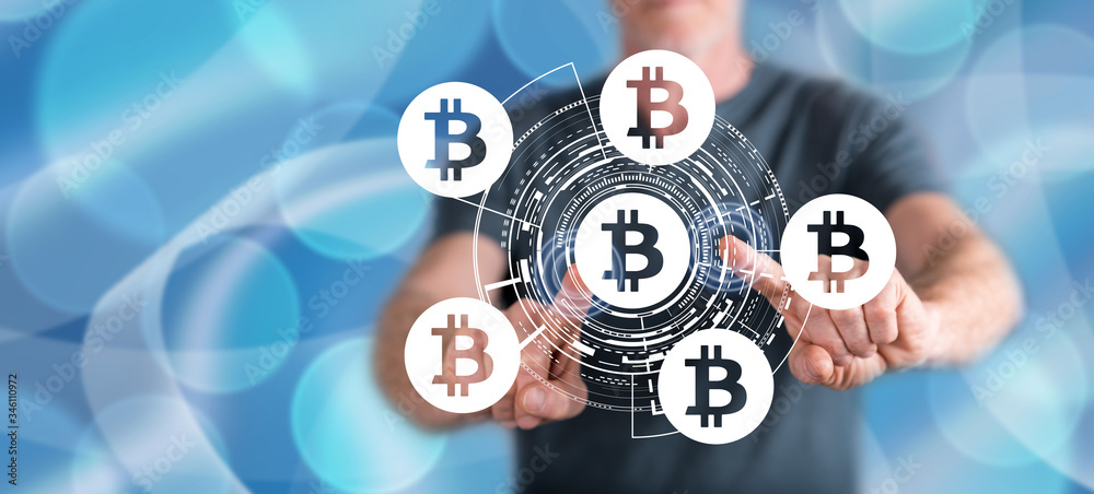 Man touching a bitcoin concept Man touching a bitcoin concept