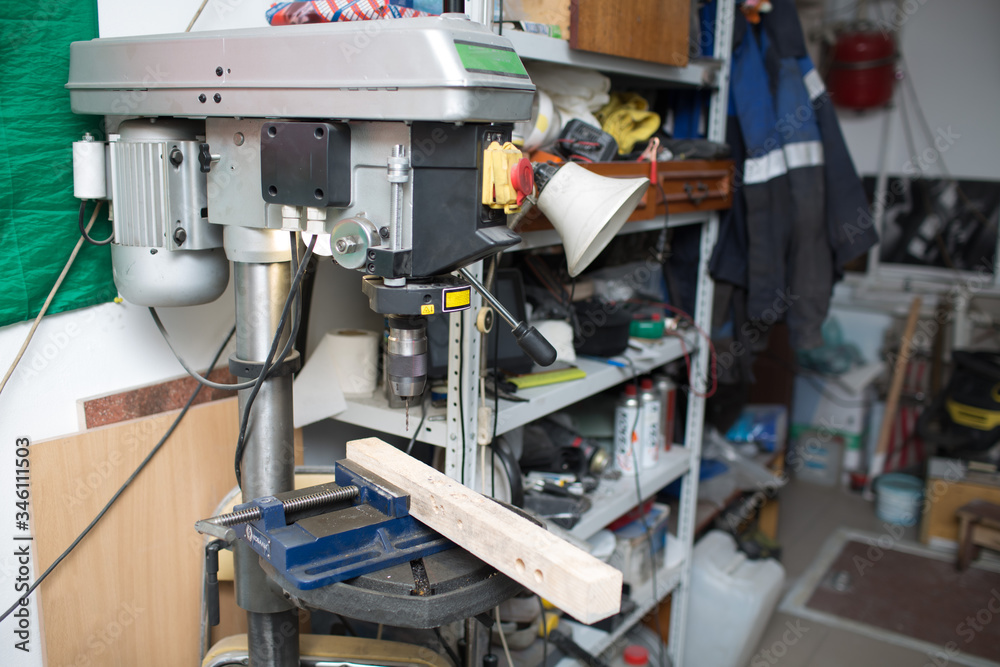 Drilling machine with laser sight in the workshop Drilling machine with laser sight in the workshop
