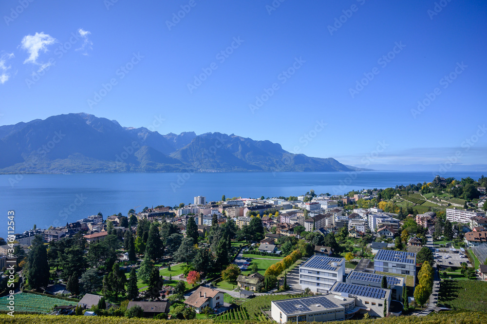 Montreux Switzerland with Geneva lake and Alps mountain in sunny day, View from Goldenpass Line train.