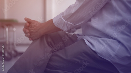 Elder Asian man worry hands while waiting for family at hospital