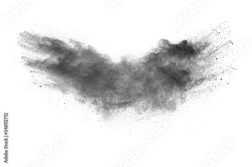 Black powder explosion.The particles of charcoal splash on white background.