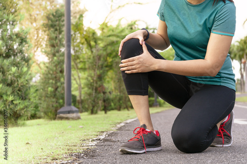 fitness woman runner feel pain on knee. Outdoor exercise activities concept