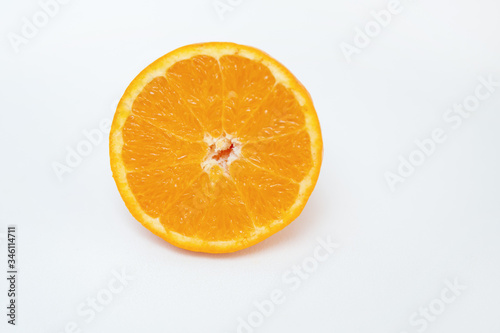 Cut refreshing orange isolated on white background. Half of orange. Close-up side view. Citrus fruit  vitamin and healthy food concept