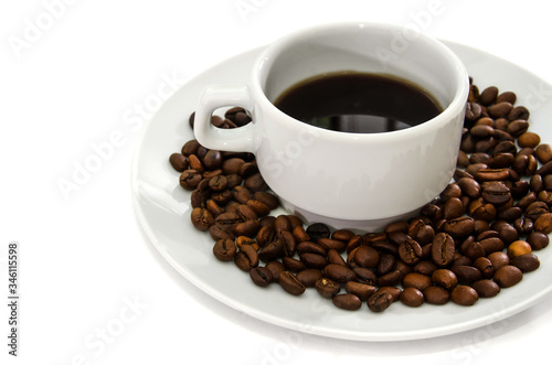 white cup of coffee in a white plate. Coffee beans. White background.
