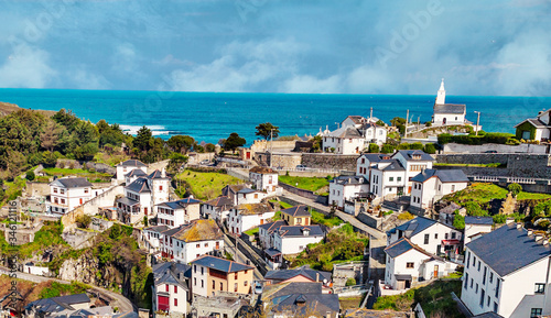 Luarca village in Asturias in the north of Spain in a cloudy day photo