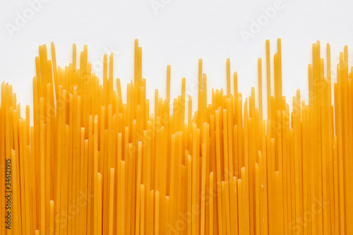 Raw spaghetti pasta on white background
